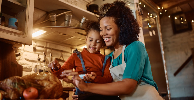 Cooking fall recipes - mom and daughter