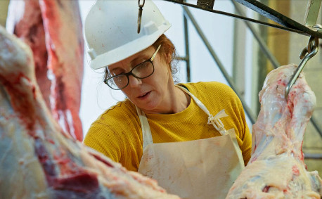 Amie Brunkow, owner of Alta Vista Meat Co., processes meat.