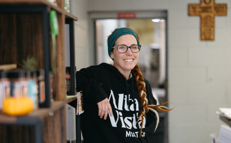 Amie Brunkow, owner of Alta Vista Meat Co., poses in the meat locker's retail store.