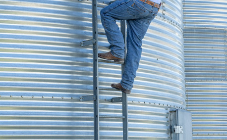 Ben inspects a grain bin.