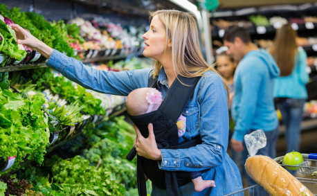 mom and baby buying vegetables