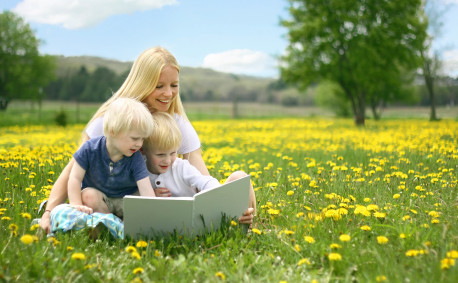 Mother Reading to Children on Farm