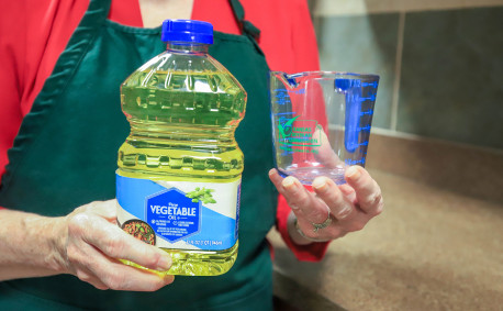 Vegetable oil and measuring cup