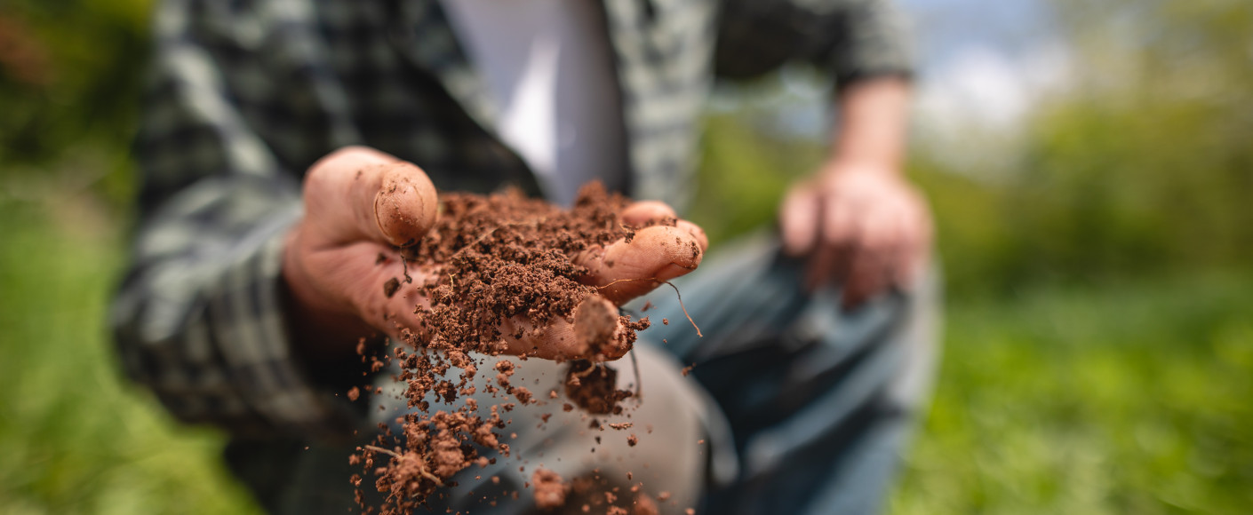 Farmer handling soil