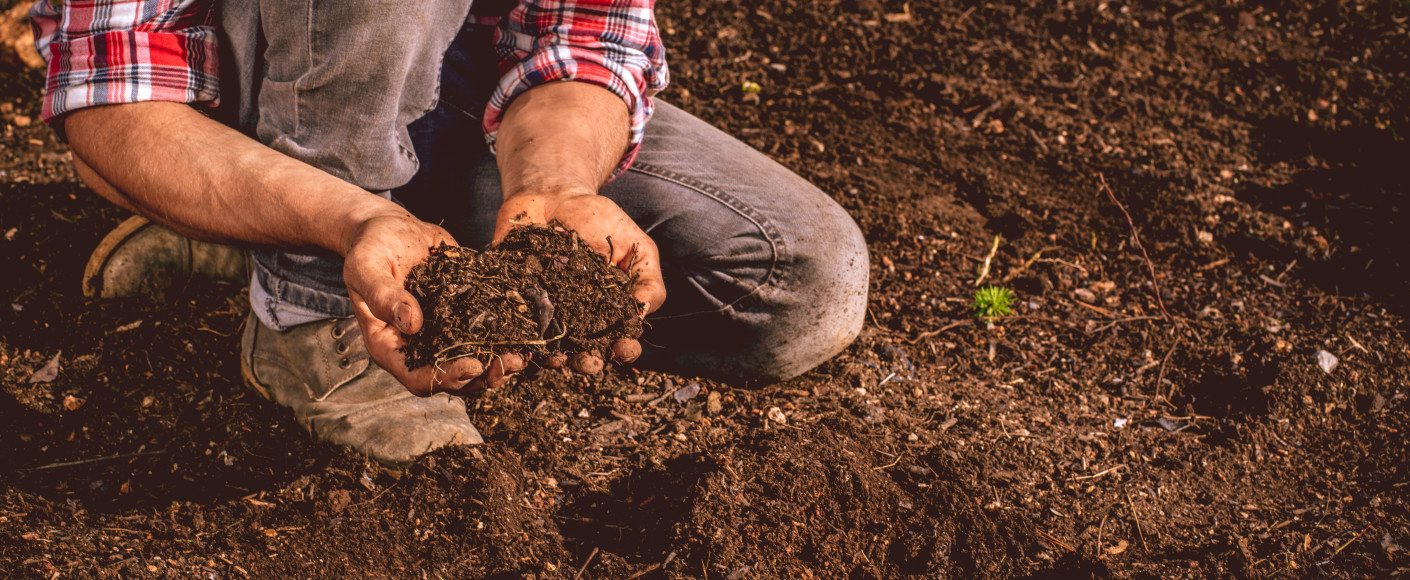 Farmer with Soil