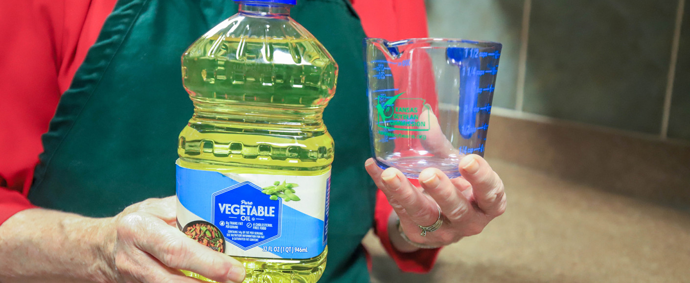 Vegetable oil and measuring cup