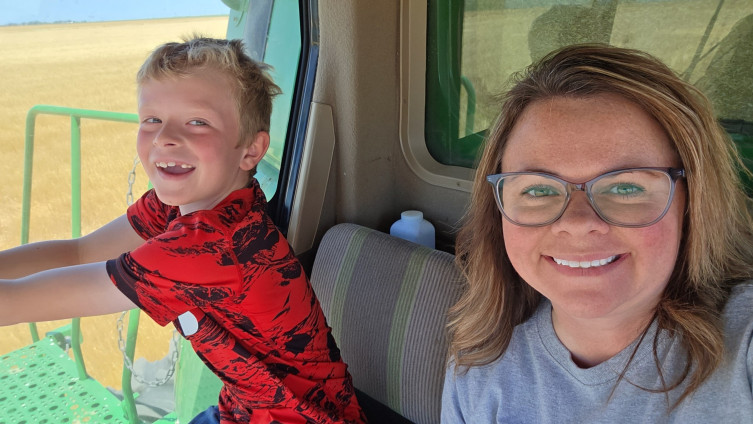 Kelsey Woelk sorghum farmer and son