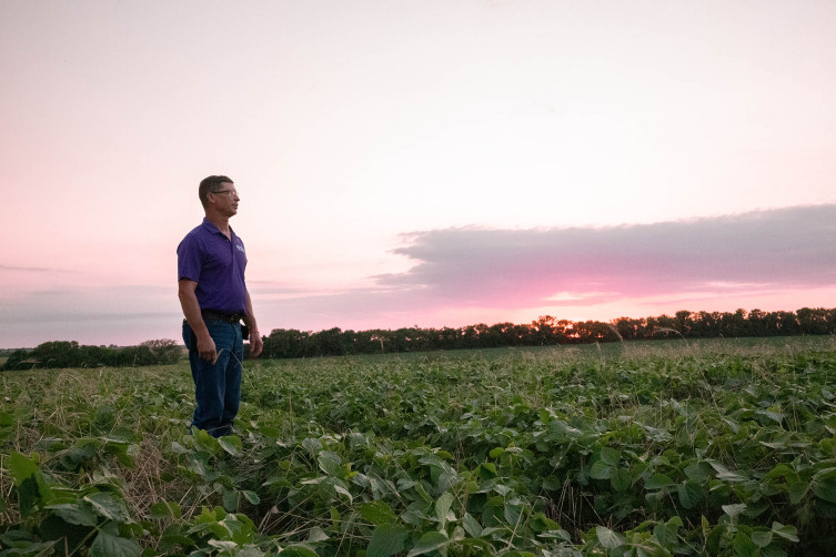 Mike Musselman in field at sunset
