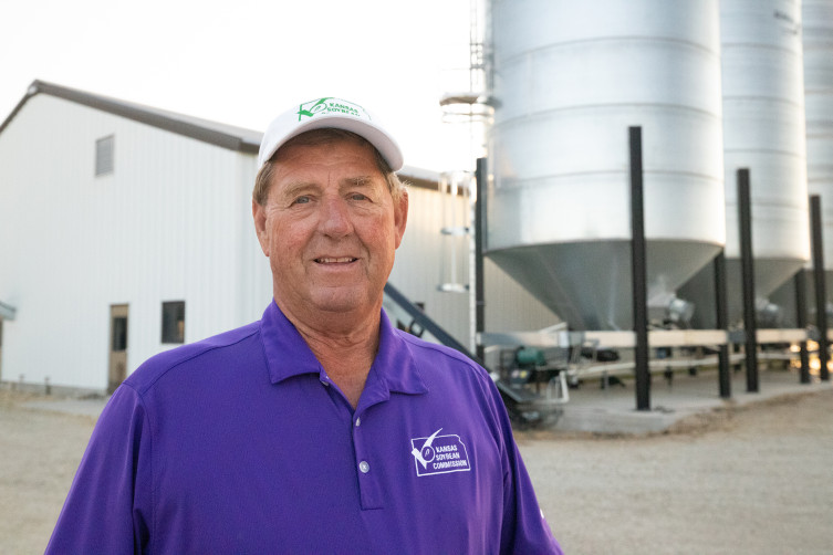 Ron Ohlde Kansas family farmer by grain bins