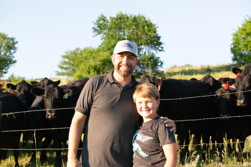 Daniel Anderes and his son with cattle
