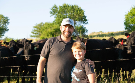 Daniel Anderes and his son with cattle